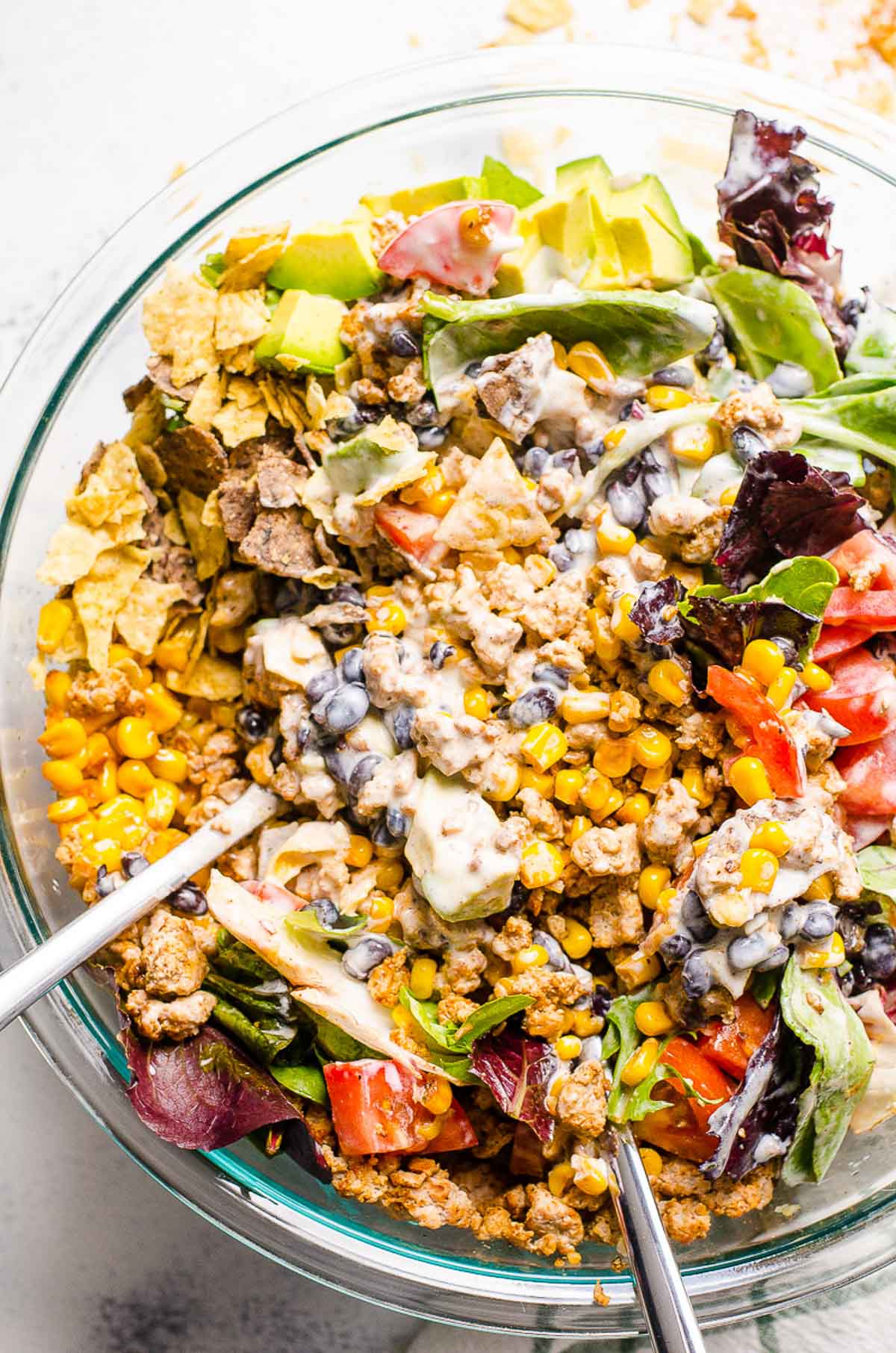 Healthy taco salad with ground turkey, lettuce, black beans and vegetables.