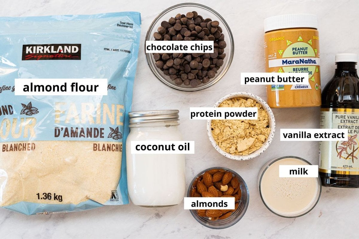 Almond flour, peanut butter, protein powder, chocolate chips, coconut oil, almonds, milk, vanilla extract.