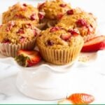 Healthy strawberry muffins on serving stand.