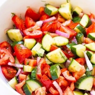 Ukrainian cucumber and tomato salad in a bowl.