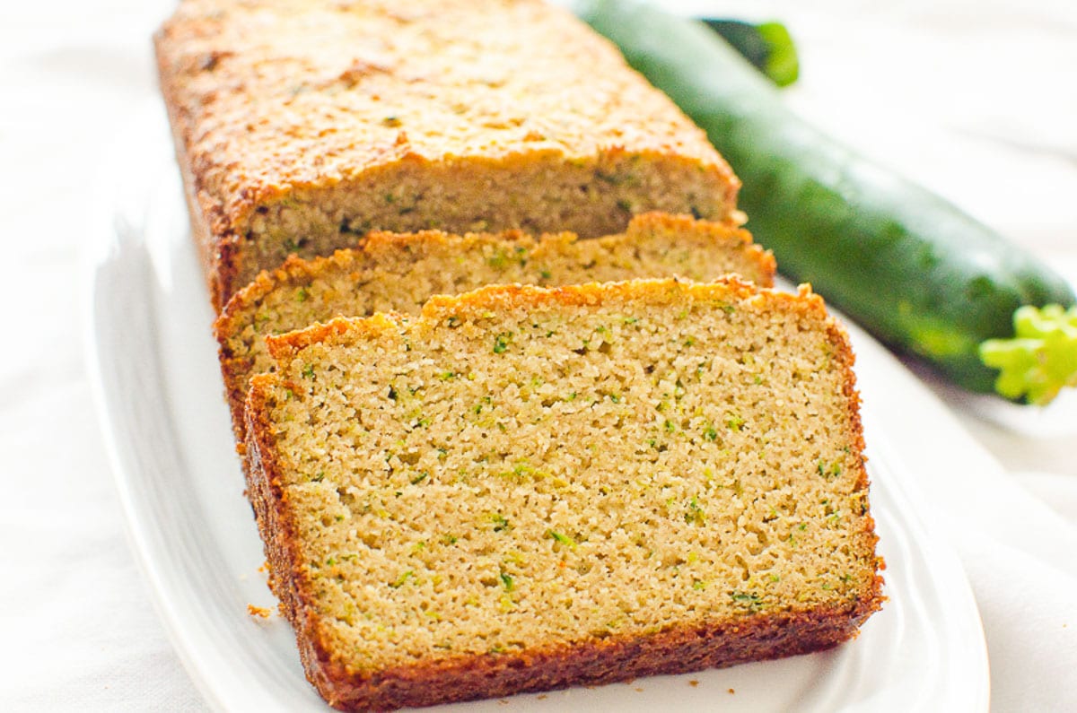 Slices of zucchini bread on white plate.