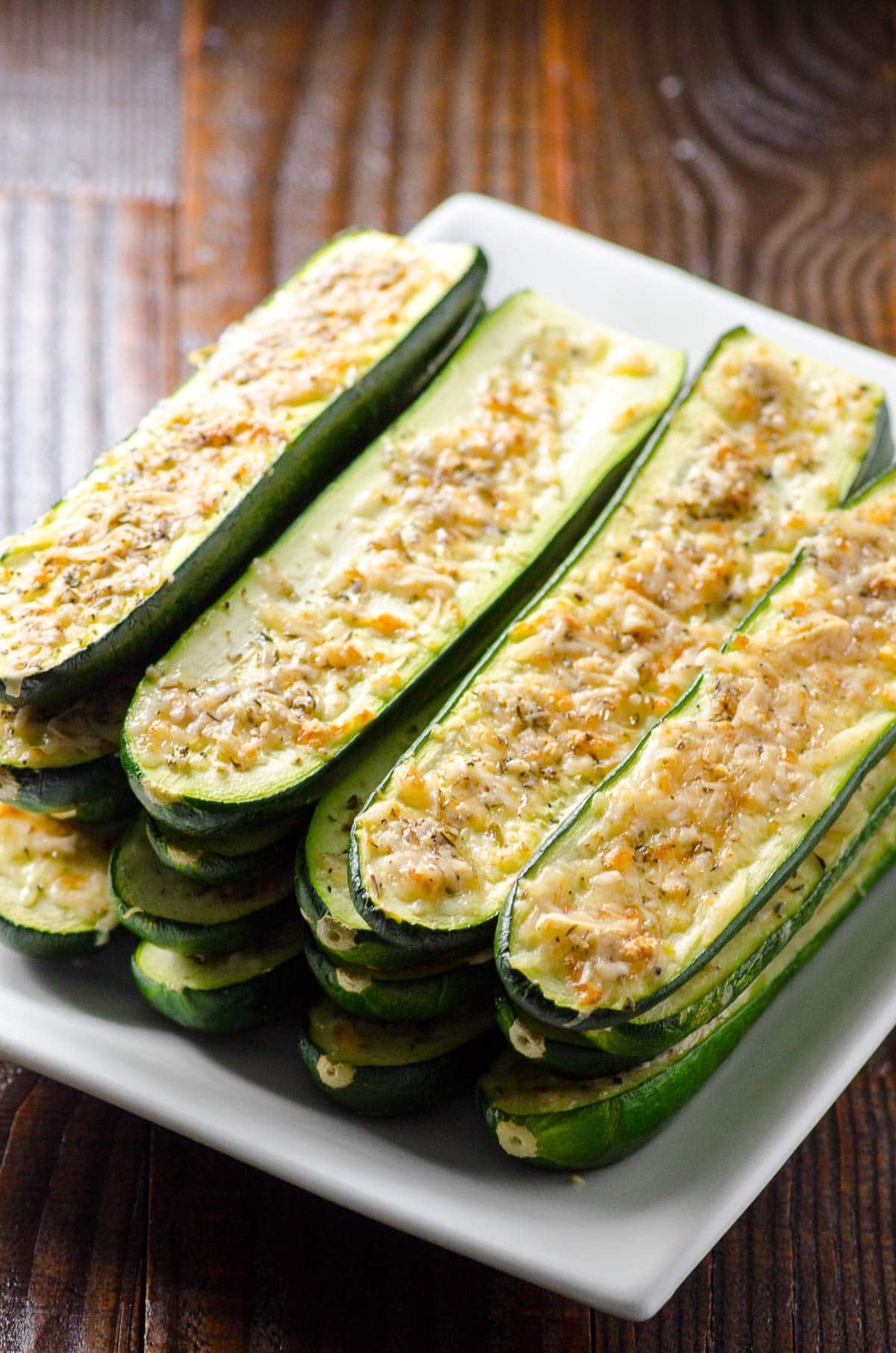 A side view of baked parmesan zucchini sticks.
