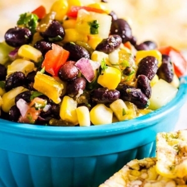 Black bean and corn salsa in a blue bowl.