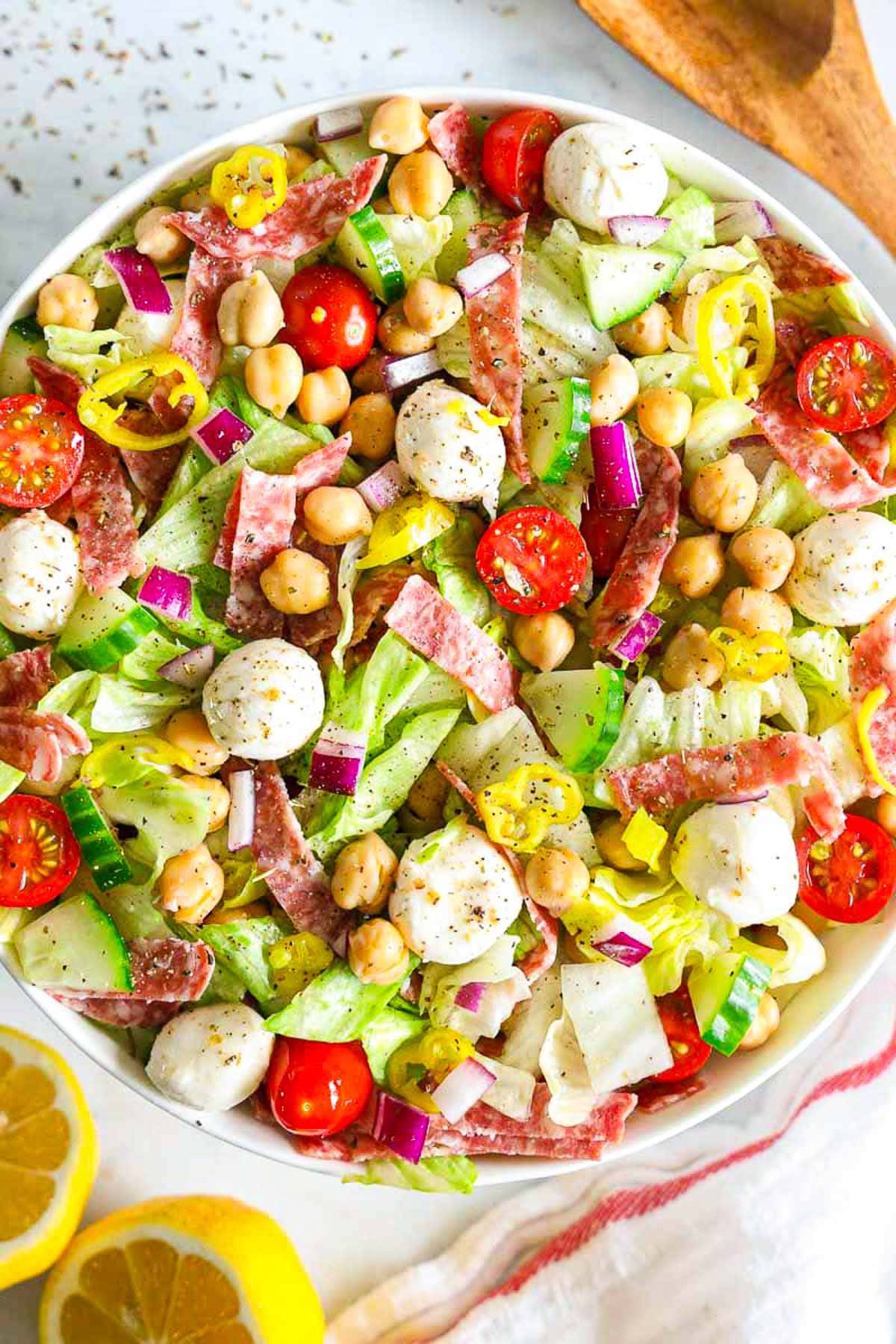 Italian chopped salad tossed together in a large serving bowl.