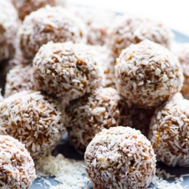 No bake protein balls rolled in coconut flakes.