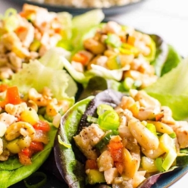 Healthy chicken lettuce wraps on a plate.