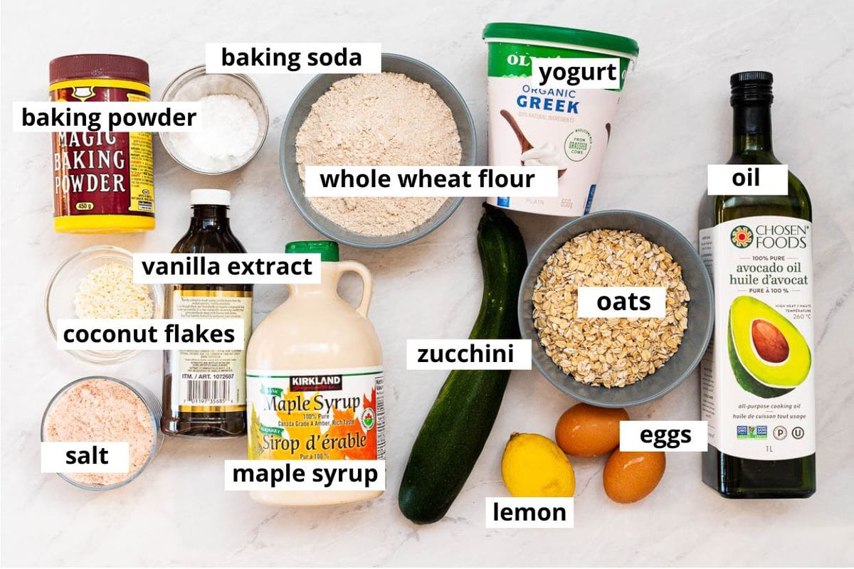 Yogurt, lemon, zucchini, oats, eggs, oil, maple syrup, whole wheat flour, coconut flakes, vanilla extract, baking powder, baking soda, salt. 