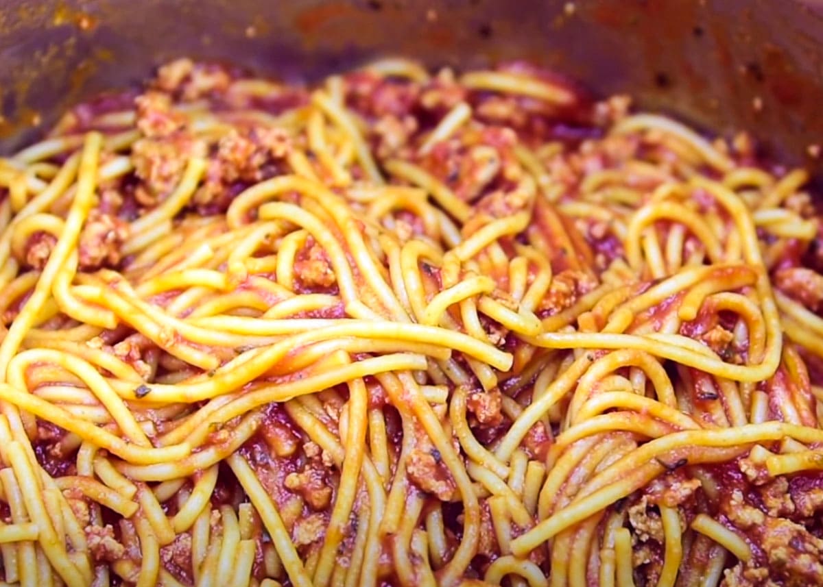 Cooked spaghetti with meat sauce closeup.