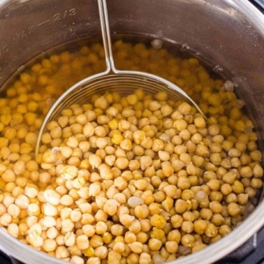 Instant Pot chickpeas in pressure cooker pot with strainer.