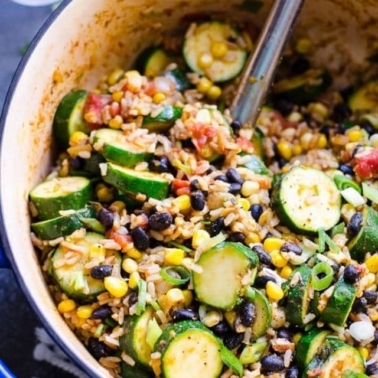 Rice and beans with zucchini in a pot.