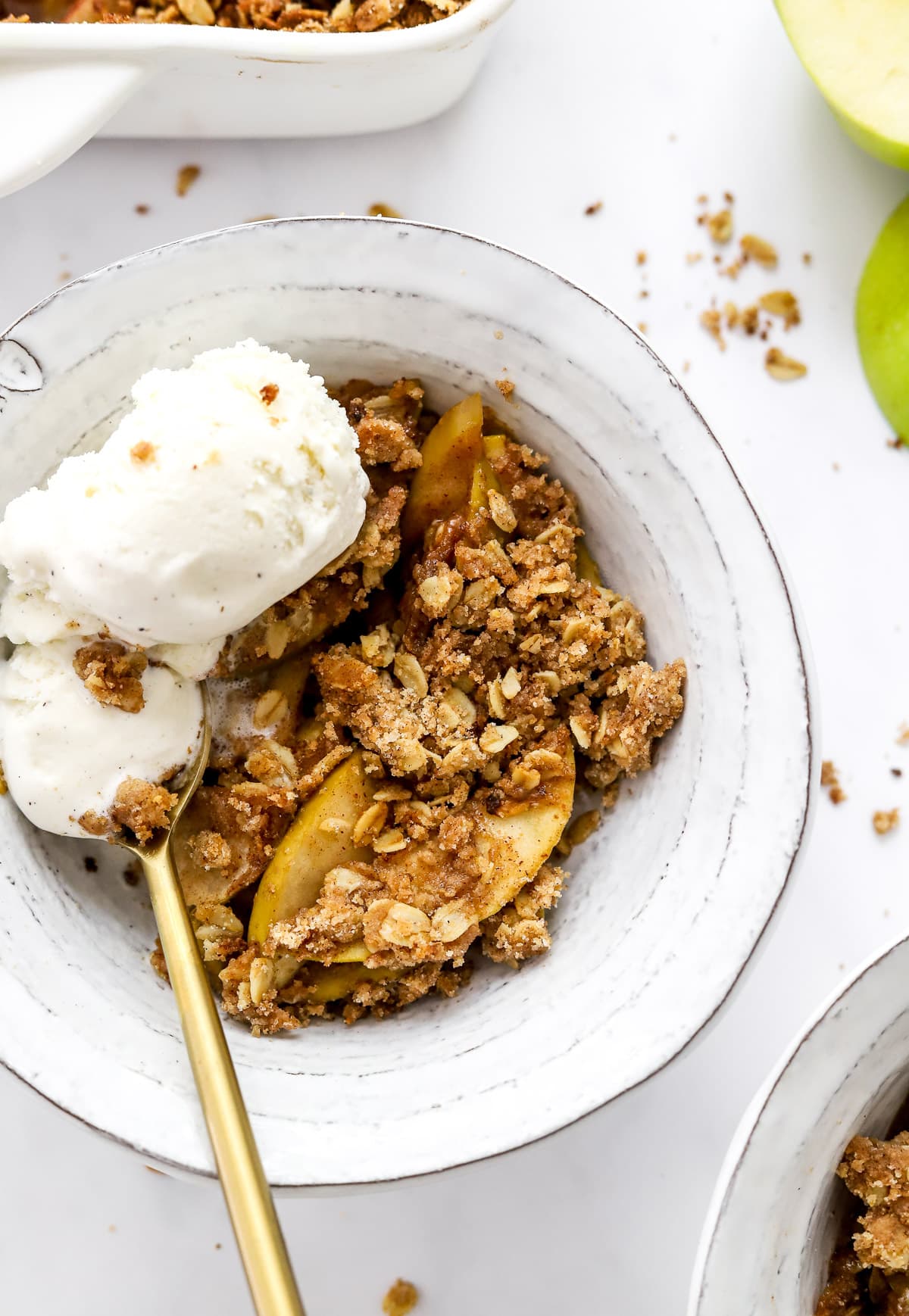 Healthy apple crisp close up in a bowl with ice cream. 