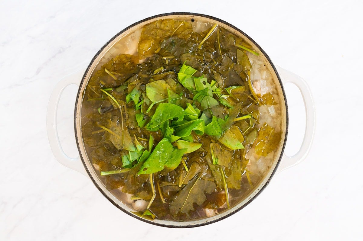 Wilted sorrel in soup pot.