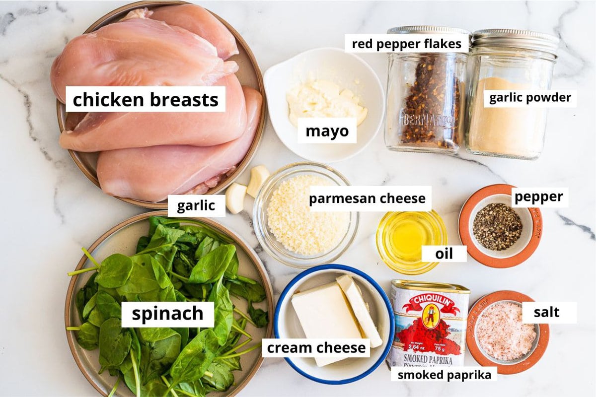Chicken breasts, spinach, mayo, garlic, parmesan cheese, cream cheese, smoked paprika, red pepper flakes, garlic powder, salt, pepper, oil.
