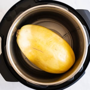 Whole spaghetti squash cooked in Instant Pot on a trivet.