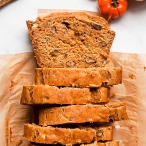 Sliced pumpkin banana bread on a parchment paper.