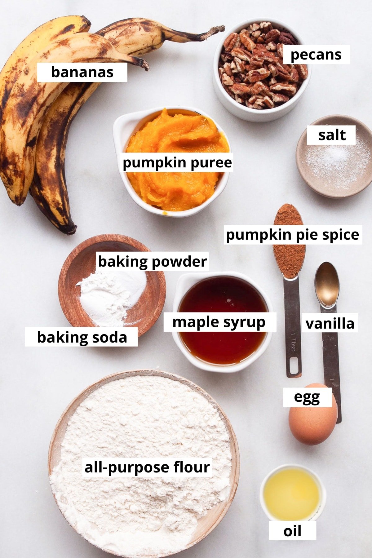 Bananas, pumpkin puree, pecans, egg, oil, pumpkin pie spice, vanilla, salt, baking powder, baking soda, egg, maple syrup, all purpose flour.