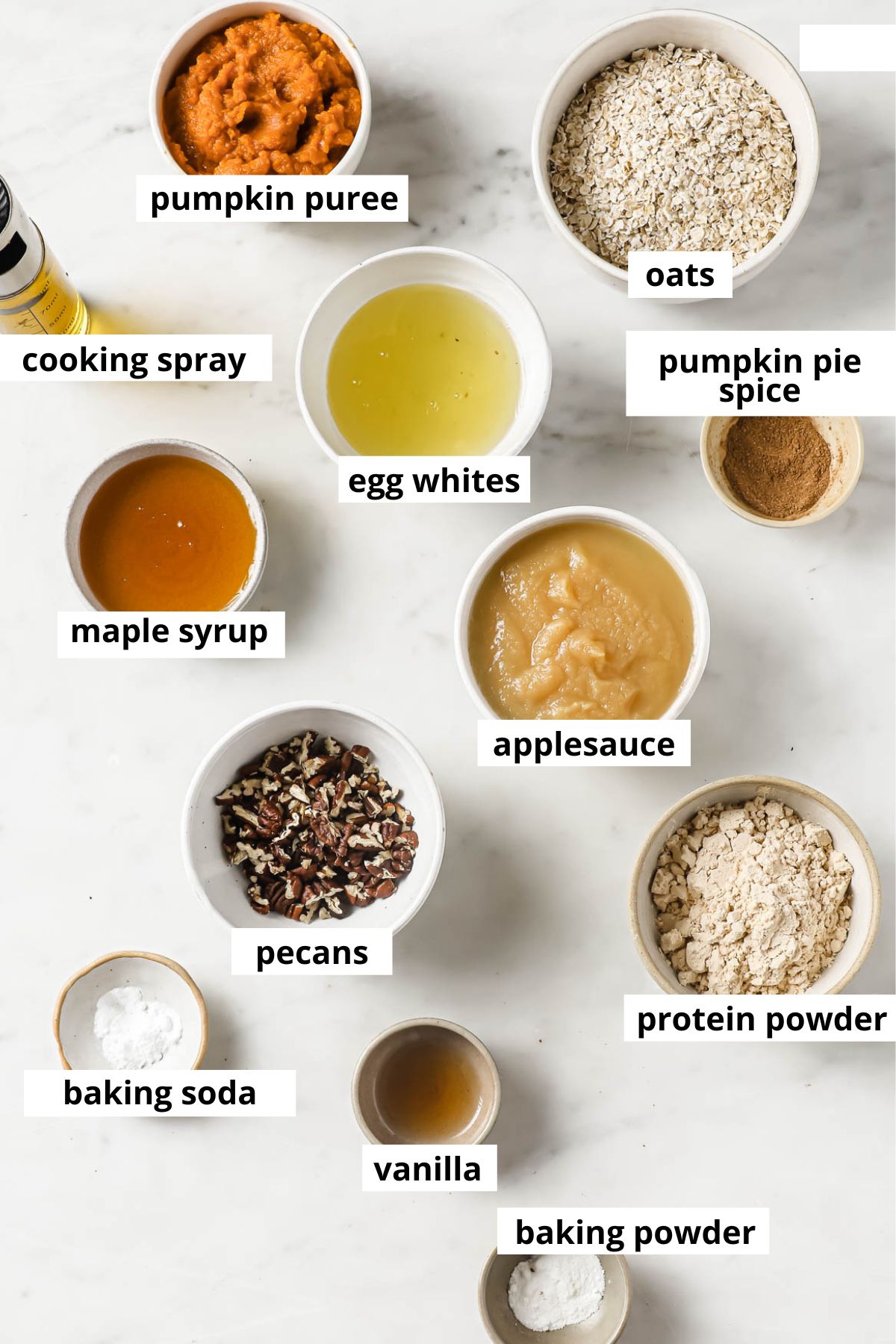 Pumpkin, oats, applesauce, maple syrup, protein powder, egg whites, pumpkin pie spice, pecans, baking powder and soda, vanilla extract, cooking spray.