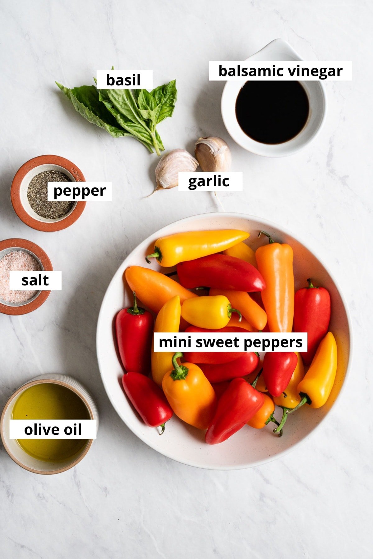 Raw mini sweet peppers, garlic cloves, fresh basil, olive oil, balsamic vinegar, salt and pepper.