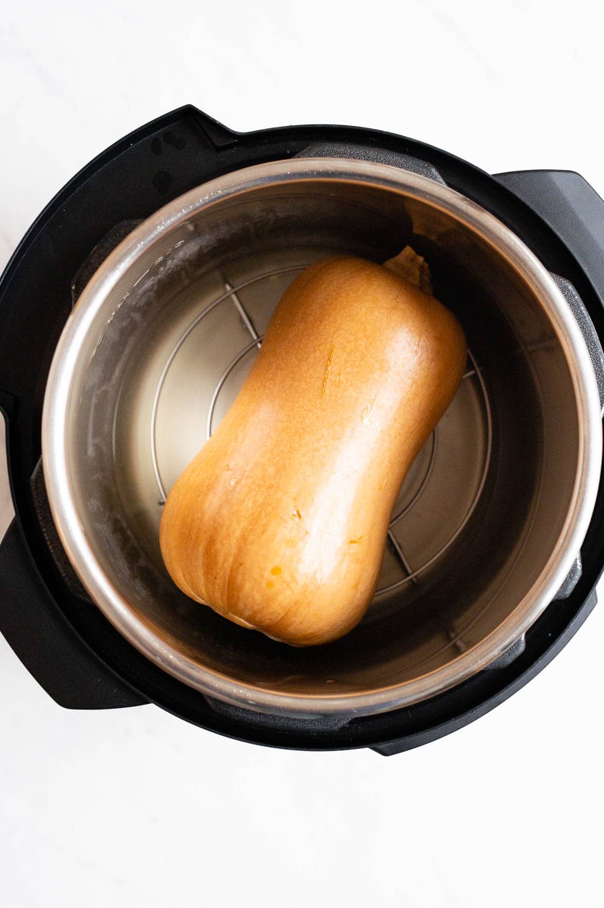 A whole butternut squash in Instant Pot.