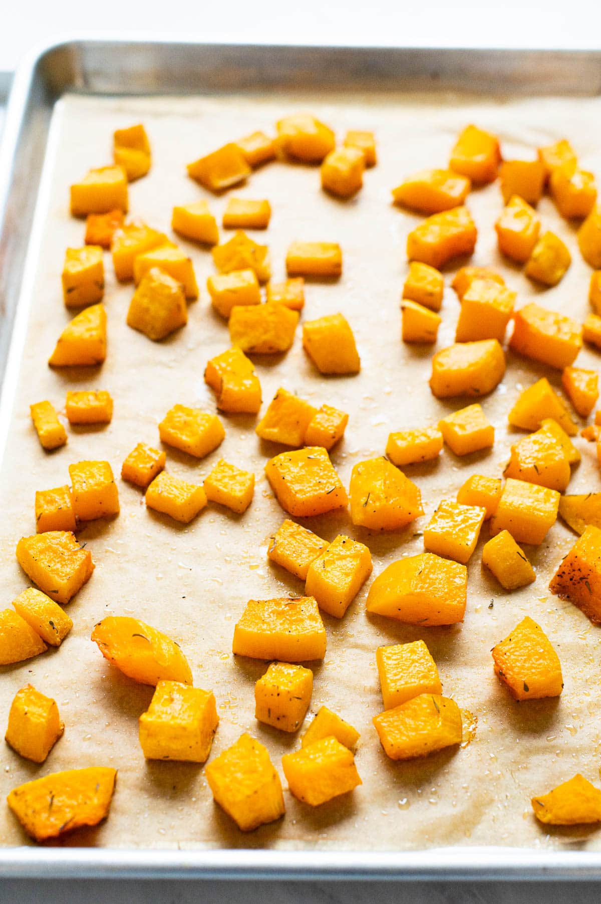 Roasted butternut squash on baking sheet.