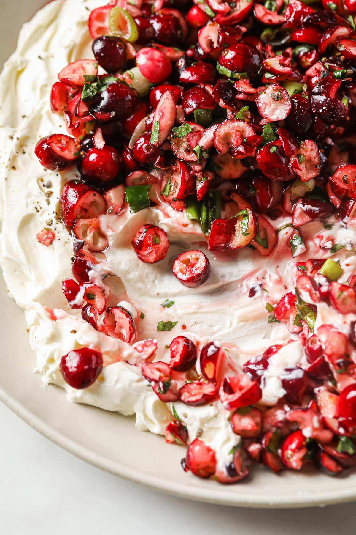 Closeup of cranberry cream cheese dip after being scooped up.