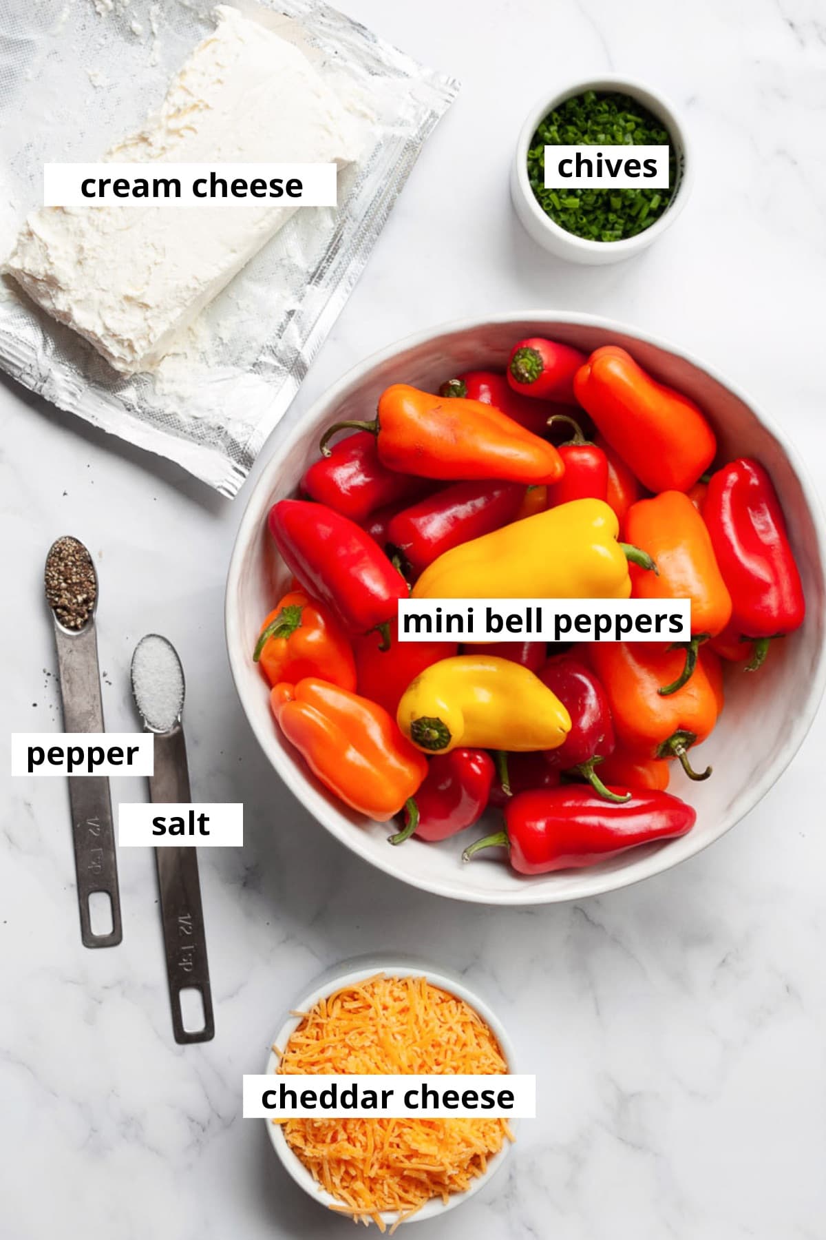 Mini bell peppers, cream cheese, cheddar cheese, chives, salt and pepper.