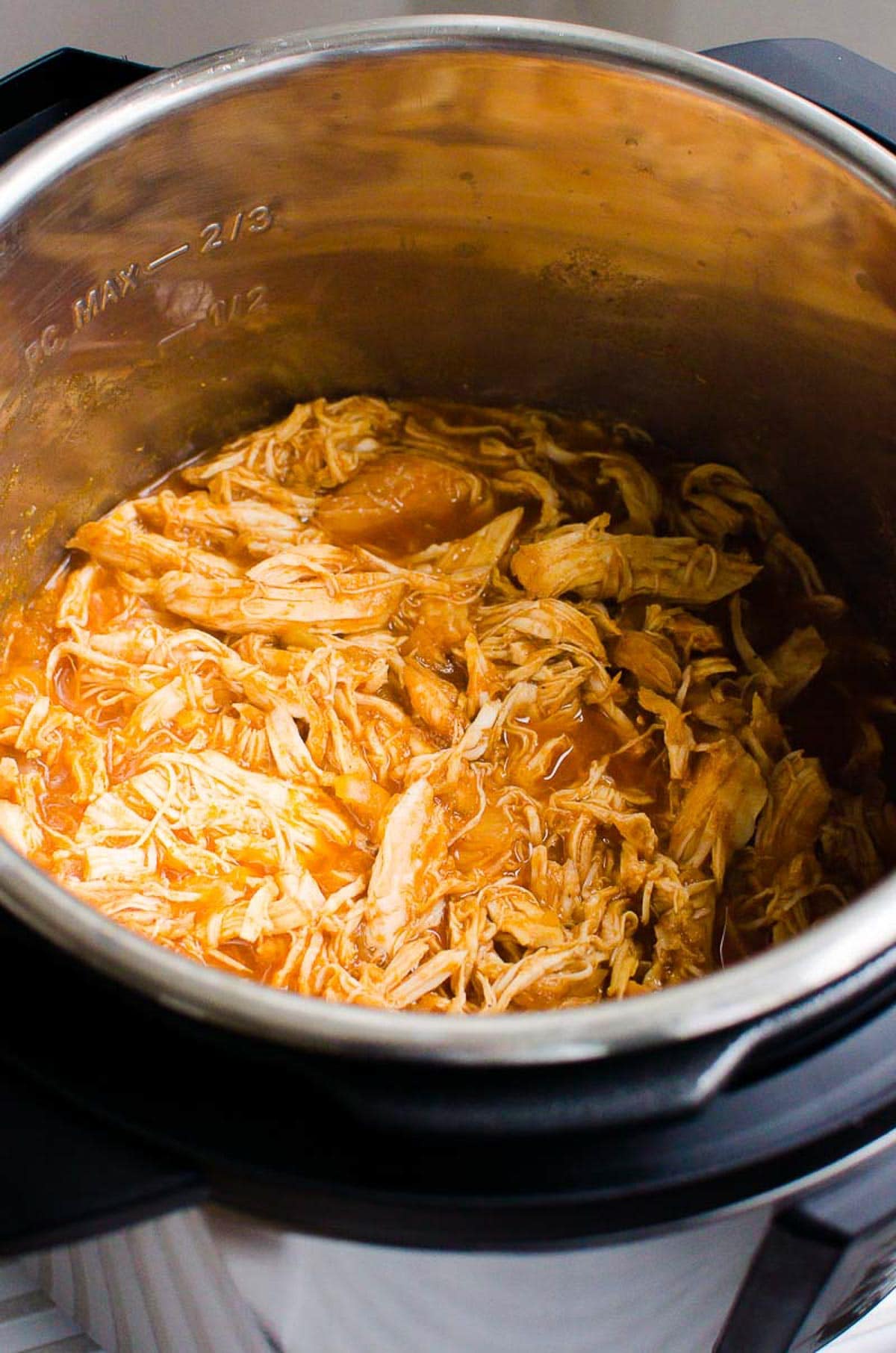 Instant Pot pulled chicken in sauce in Instant Pot.