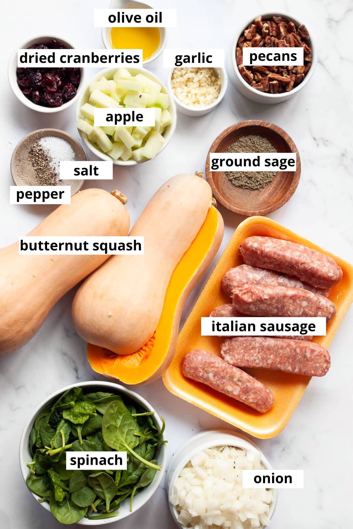Butternut squash, Italian sausage, apple, pecans, dried cranberries, olive oil, garlic, ground sage, salt, pepper, spinach, onion.