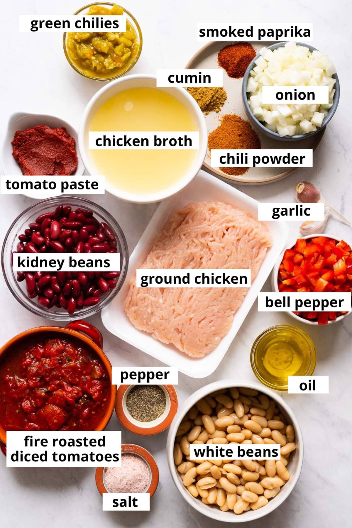 Ground chicken, onion, kidney beans, white beans, fire roasted tomatoes, bell pepper, garlic, tomato paste, green chilies, chicken broth, smoked paprika, cumin, chili powder, salt, pepper, oil.