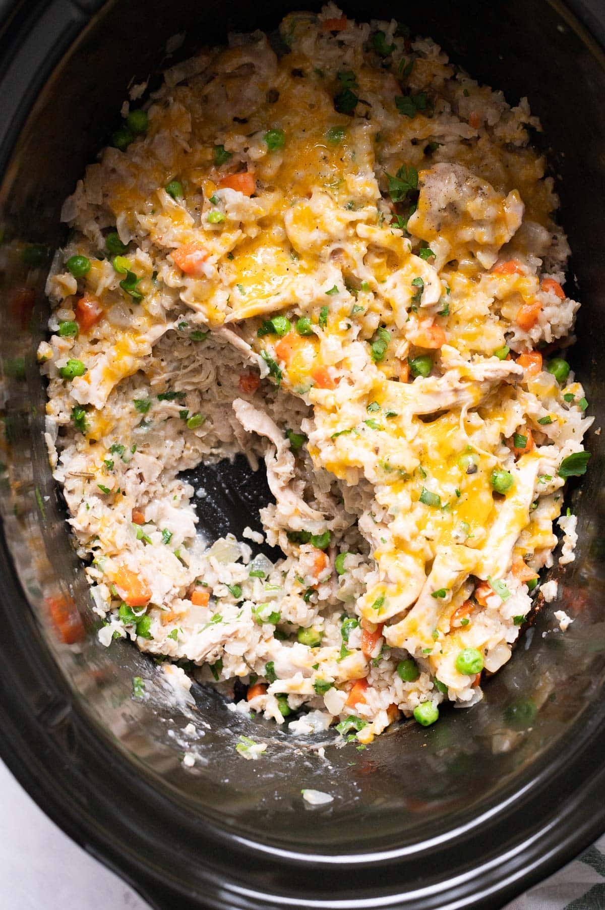 Close up showing texture of chicken and rice in Crock-Pot.
