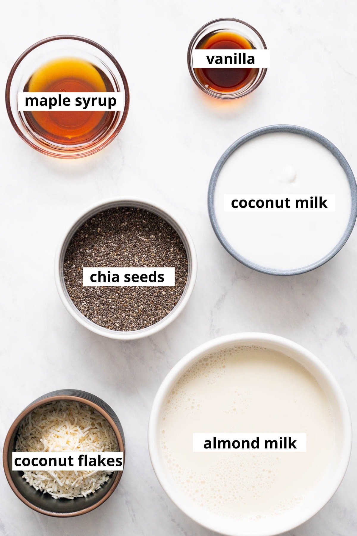 Almond milk, coconut flakes, coconut milk, chia seeds, maple syrup, vanilla.