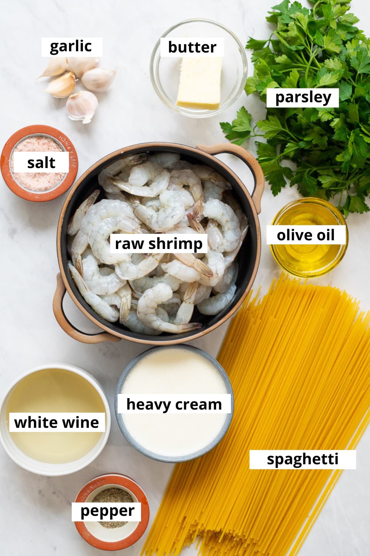 Raw shrimp, butter, garlic, parsley, olive oil, spaghetti, heavy cream, white wine, salt and pepper.