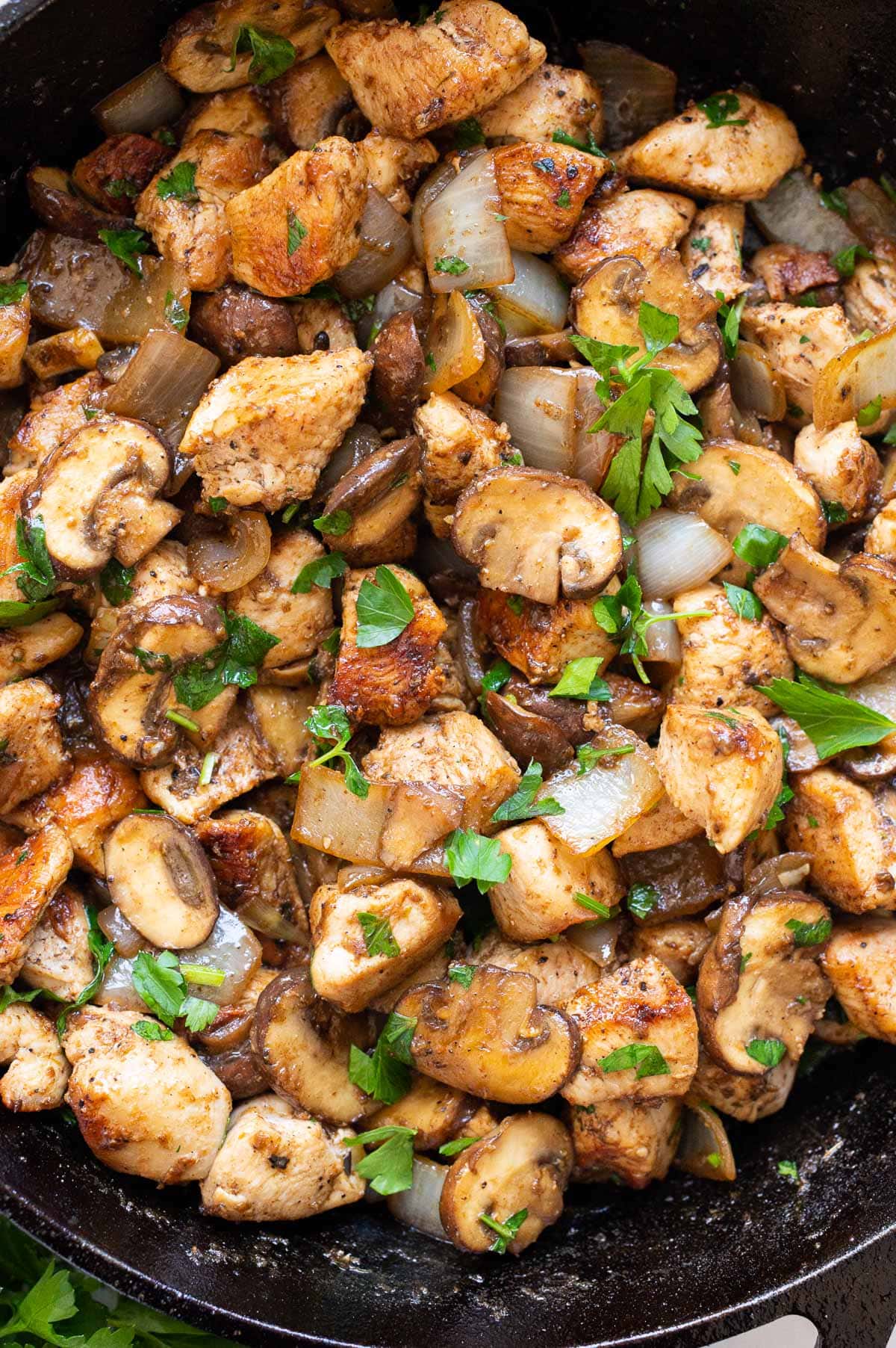 Close up off chicken and mushrooms stir fry.