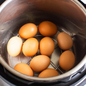 Ten hard boiled eggs in Instant Pot on a trivet.