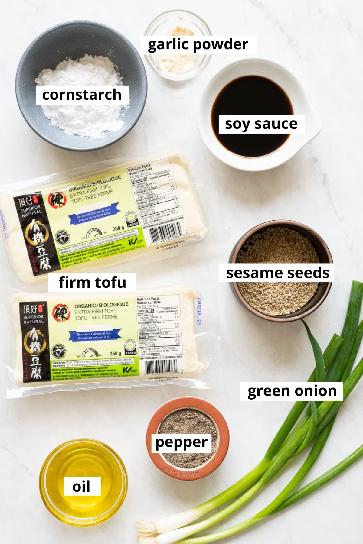 Extra firm tofu, cornstarch, soy sauce, olive oil, sesame seeds, garlic powder, green onion.