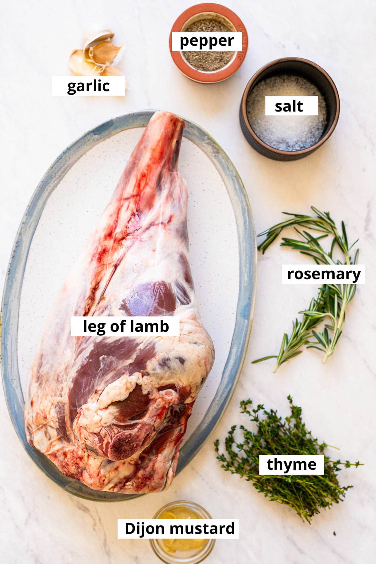 Leg of lamb, garlic, rosemary, salt, pepper, thyme, Dijon mustard.