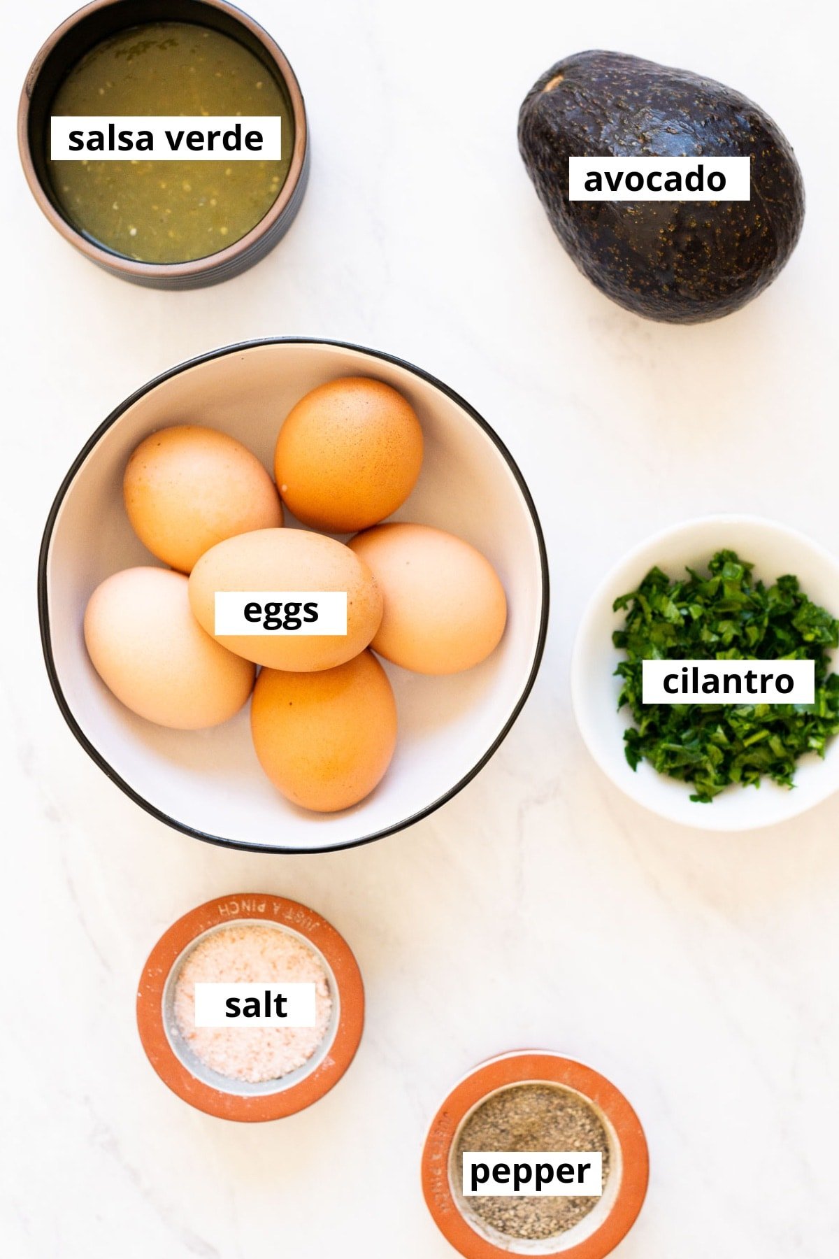 Eggs, cilantro, salsa verde, avocado, salt and pepper.