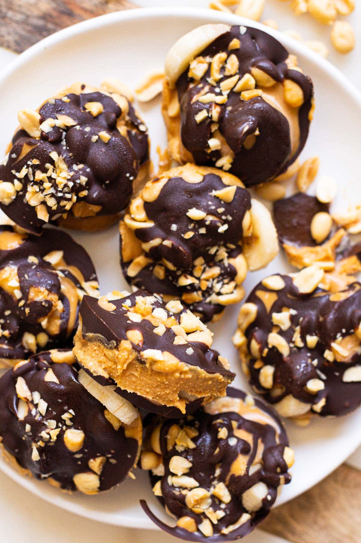 Frozen banana Snickers bites served on a platter.