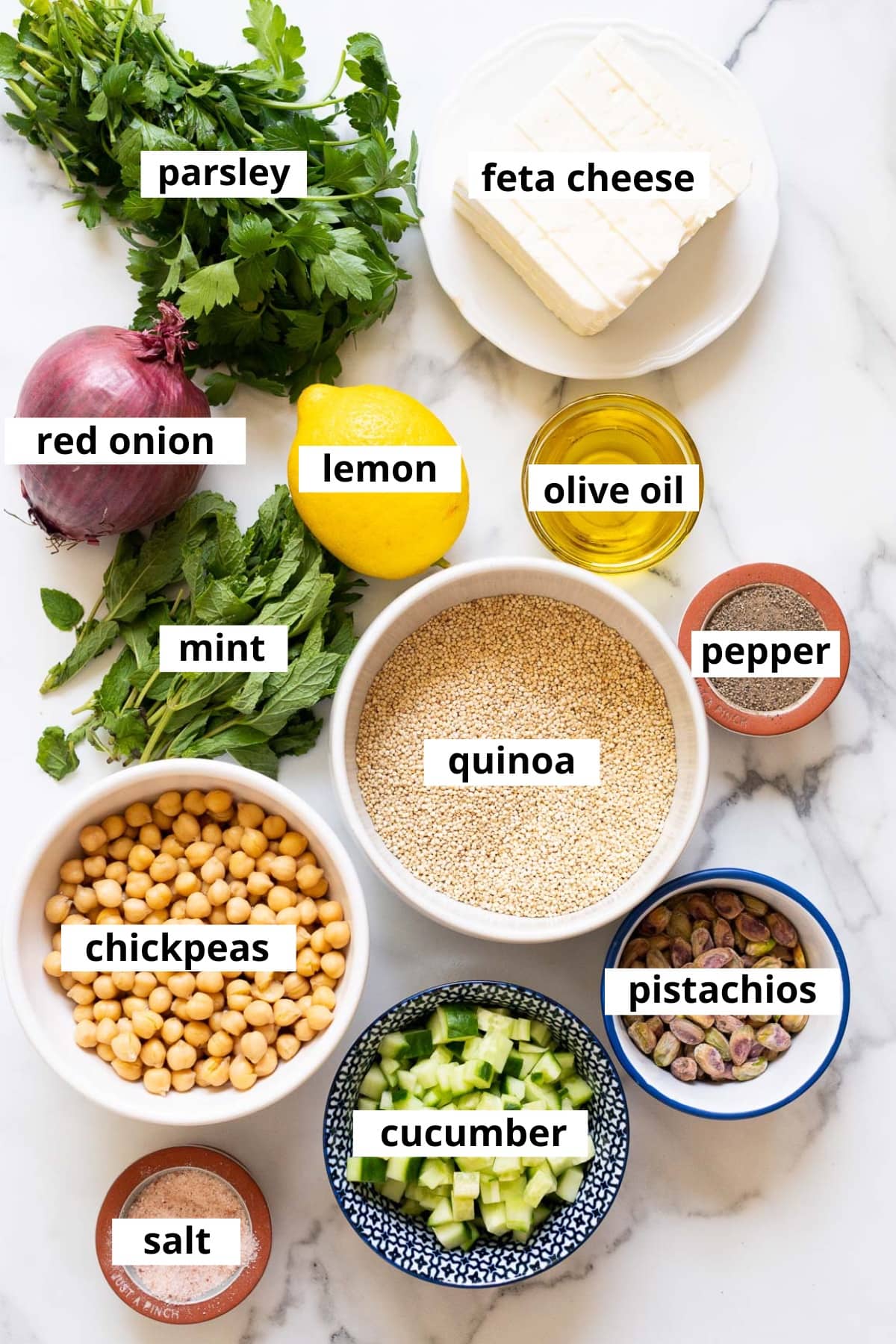 Quinoa, chickpeas, feta cheese, parsley, red onion, lemon, olive oil, mint, pepper, pistachios, cucumber, salt.