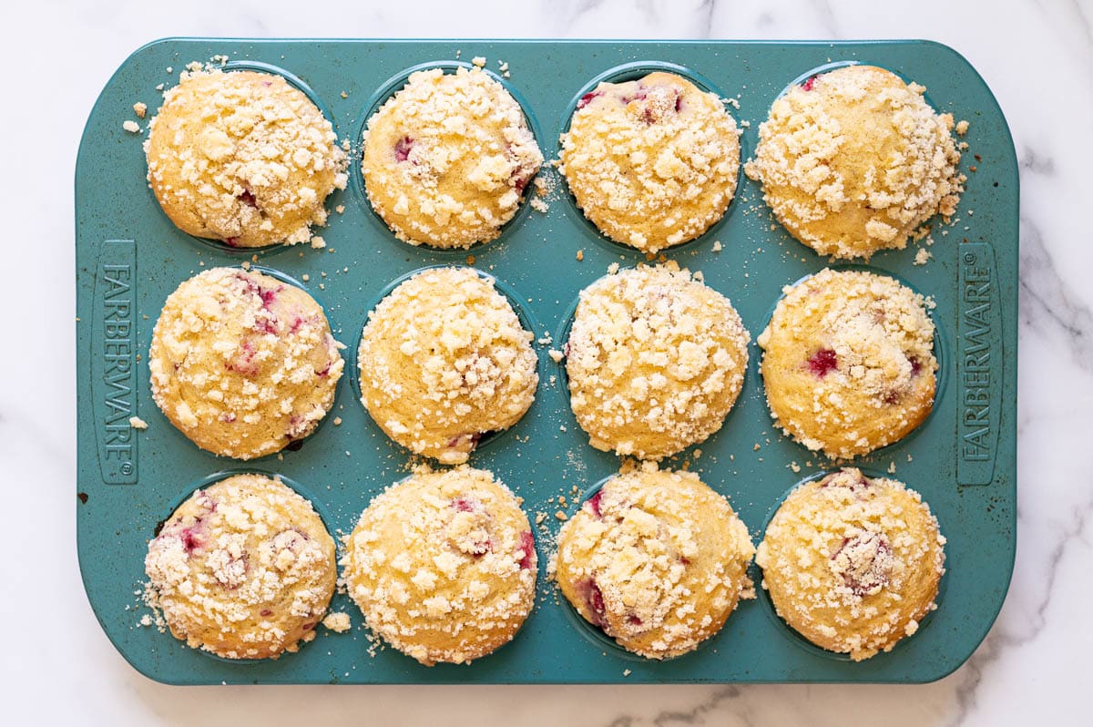 Baked raspberry muffins recipe in a muffin tin.