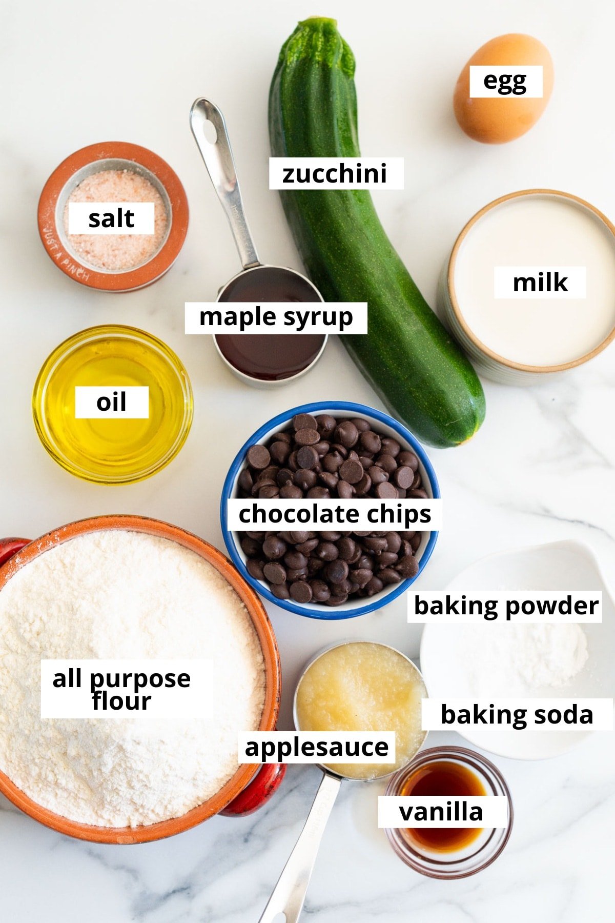 Zucchini, maple syrup, egg, milk, oil, salt, chocolate chips, baking powder, baking soda, apple sauce, vanilla, all purpose flour.