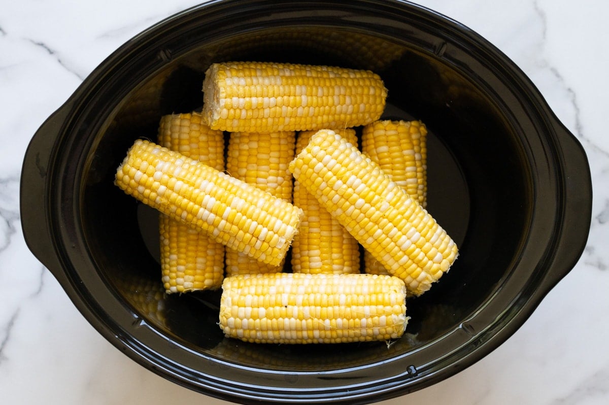 8 ears of corn on the cob in a slow cooker.