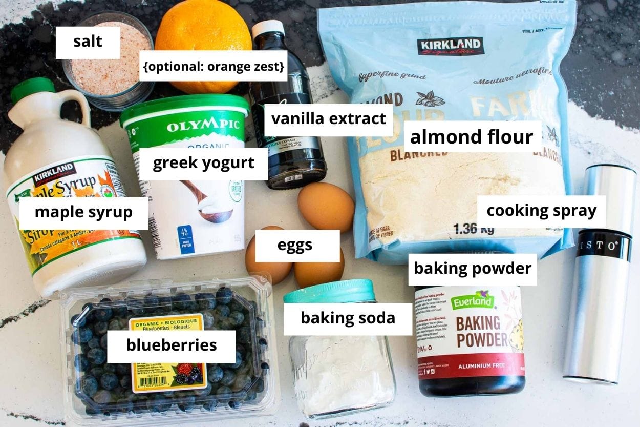 Almond flour, Greek yogurt, maple syrup, baking powder, baking soda, blueberries, eggs, orange, vanilla, cooking spray, salt.