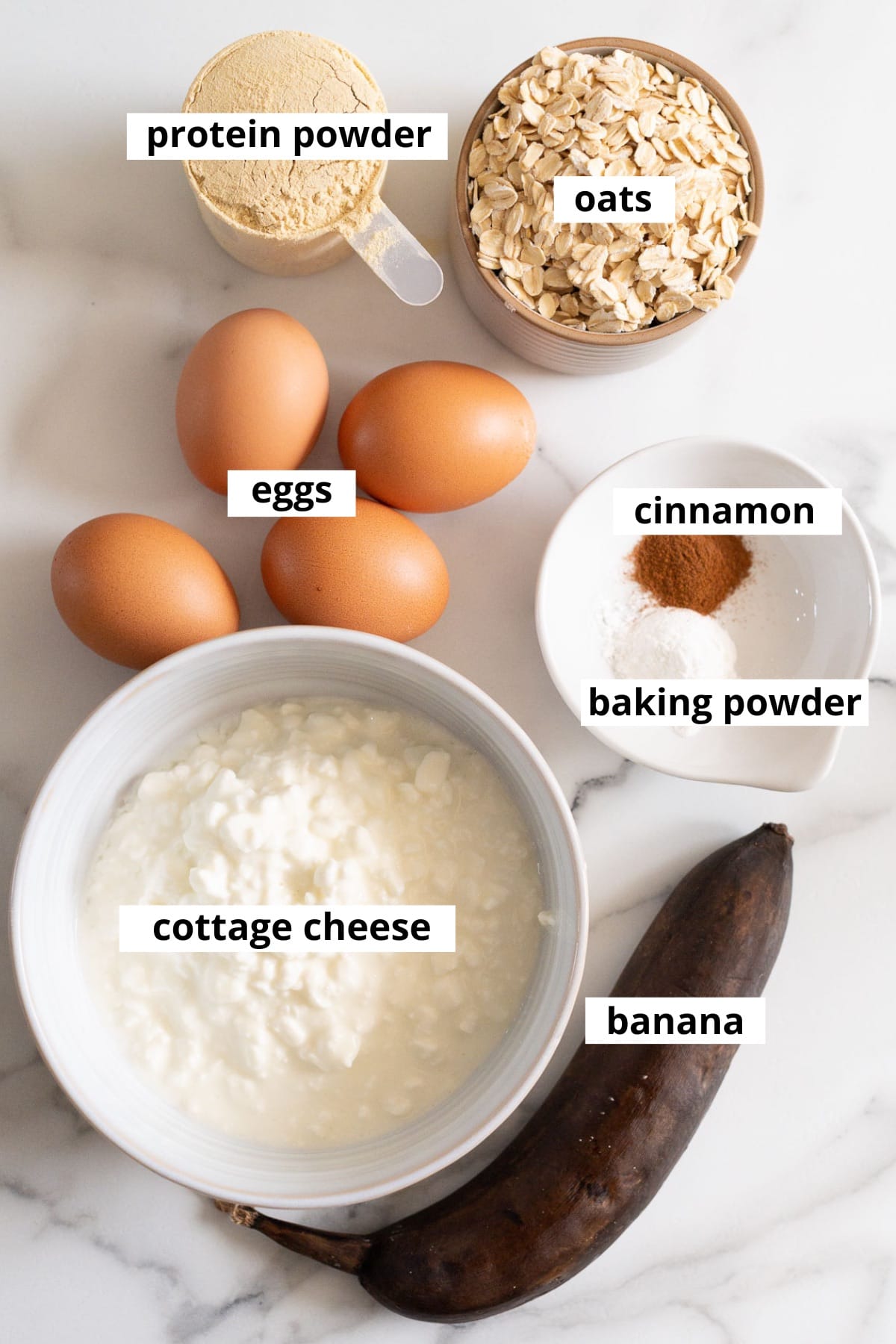 Cottage cheese, protein powder, eggs, oats, banana, baking powder and cinnamon.