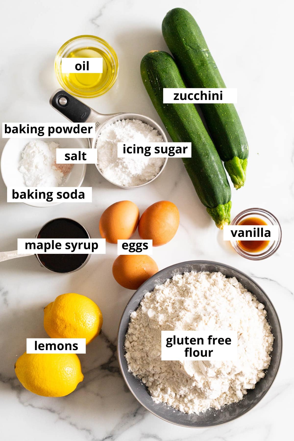 Zucchini, lemons, gluten-free flour, maple syrup, eggs, vanilla extract, oil, icing sugar, baking powder, baking soda, salt.