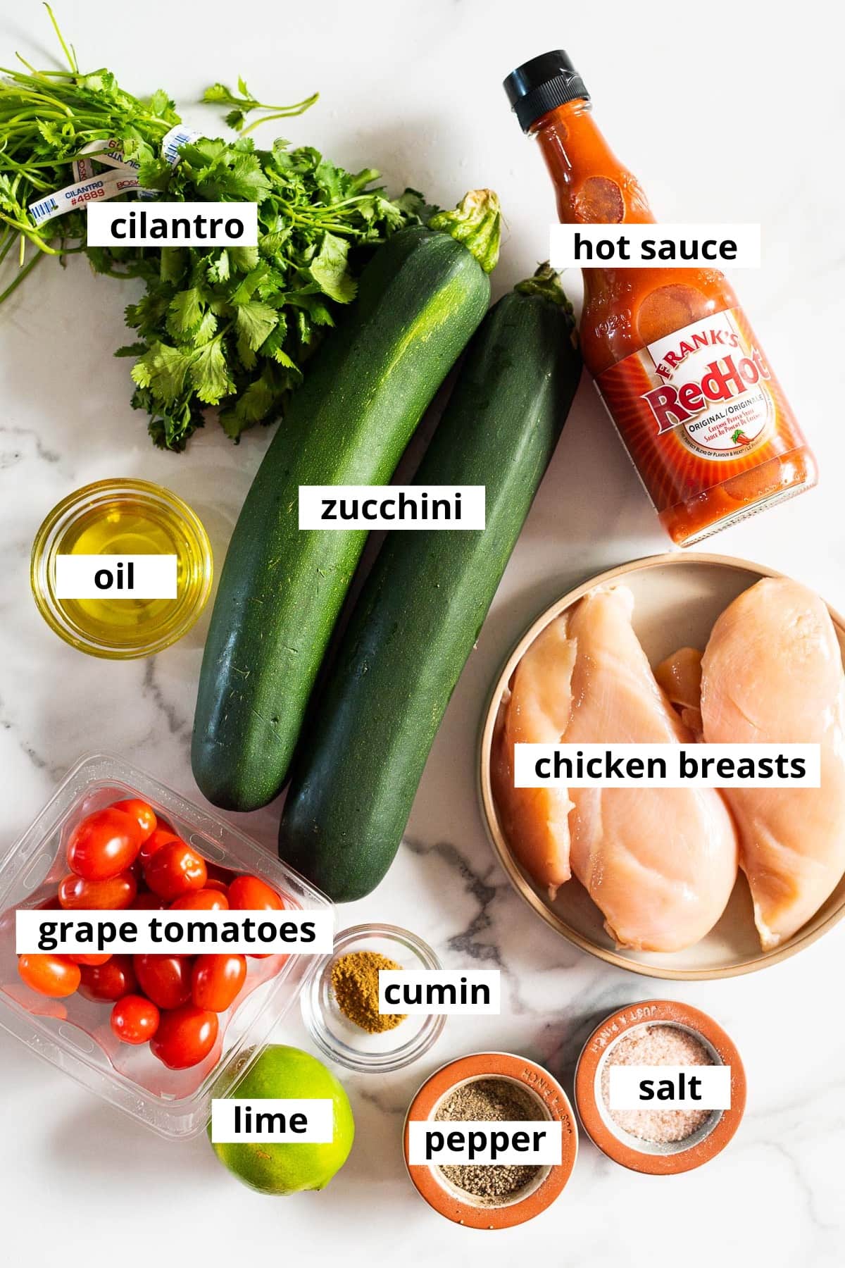 Zucchini, chicken breasts, hot sauce, oil, cilantro, grape tomatoes, lime, cumin, salt and pepper.