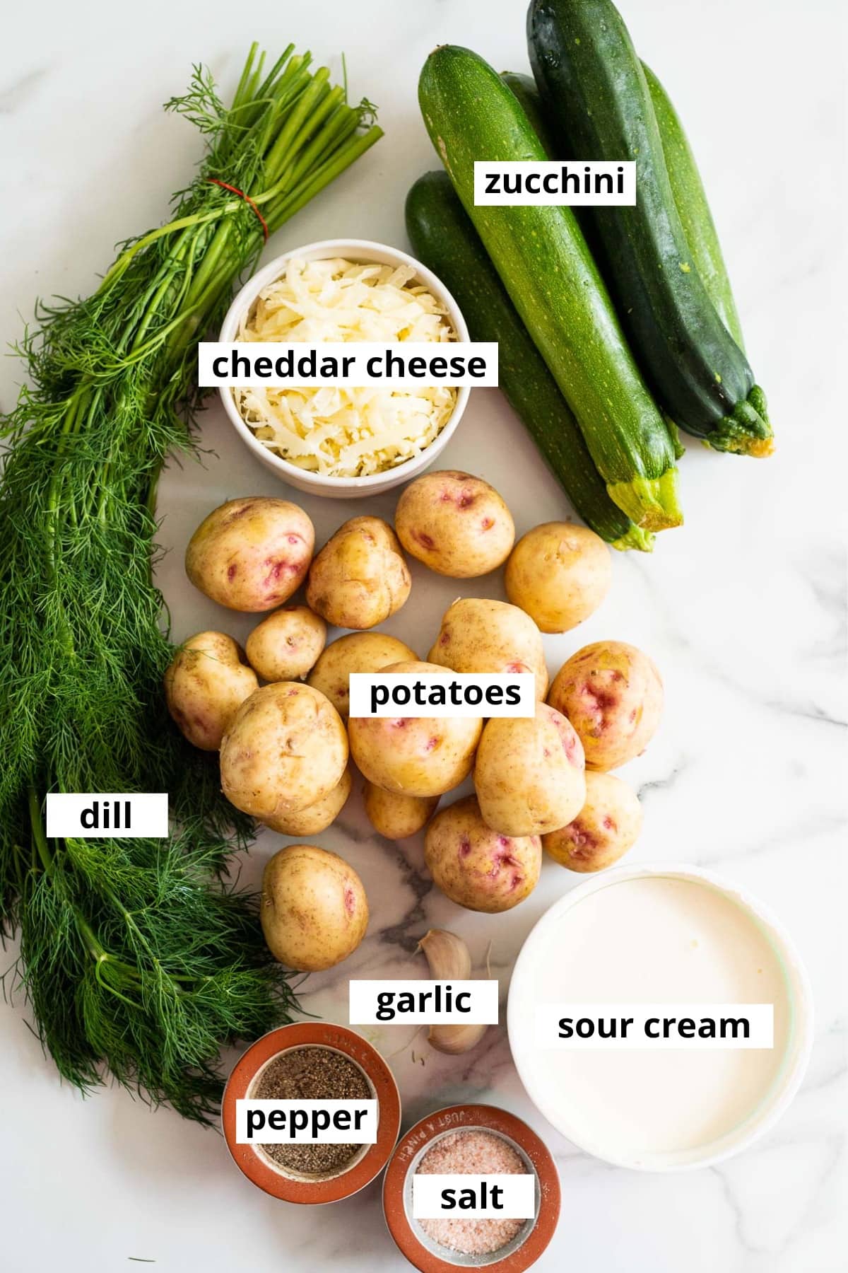 Zucchini, potatoes, cheddar cheese, dill, potatoes, garlic, sour cream, salt and pepper.