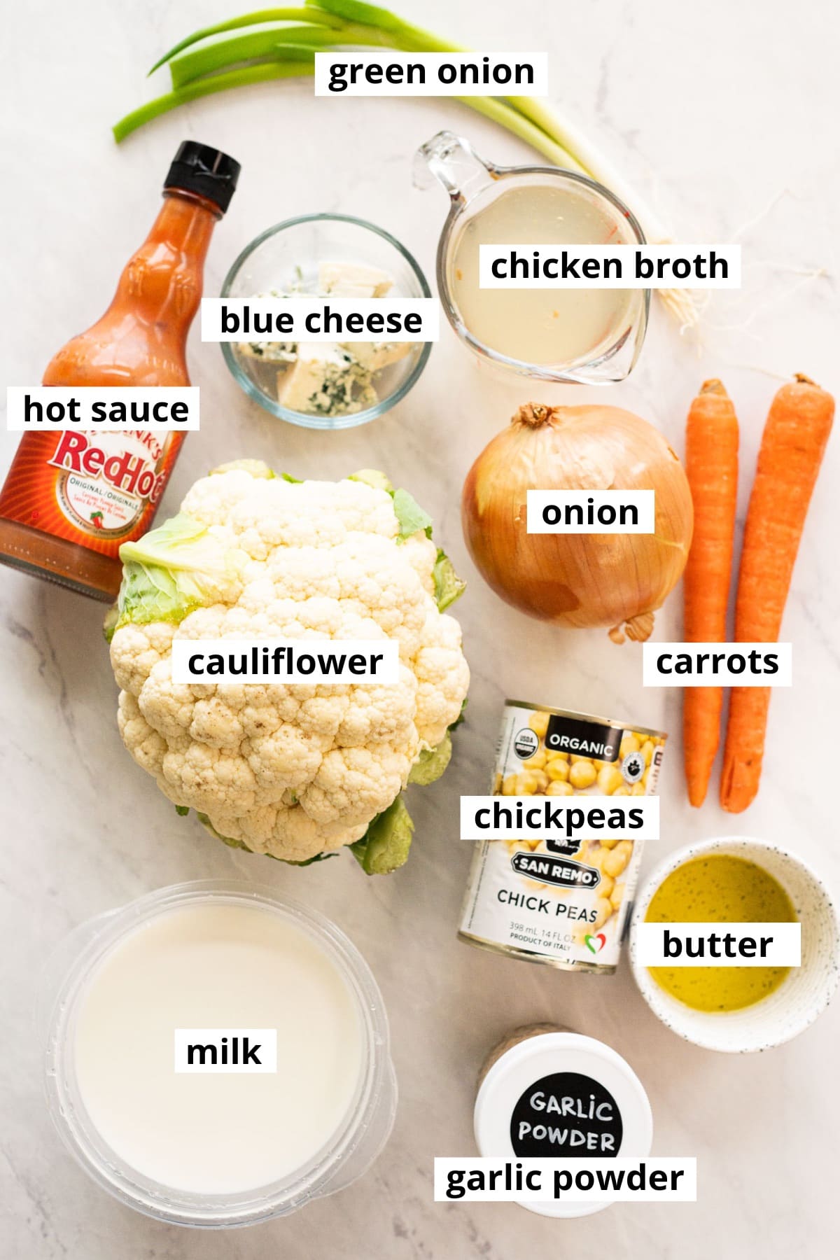 Cauliflower, carrots, onion, milk, broth, butter, chickpeas, hot sauce, blue cheese, garlic powder, green onion.