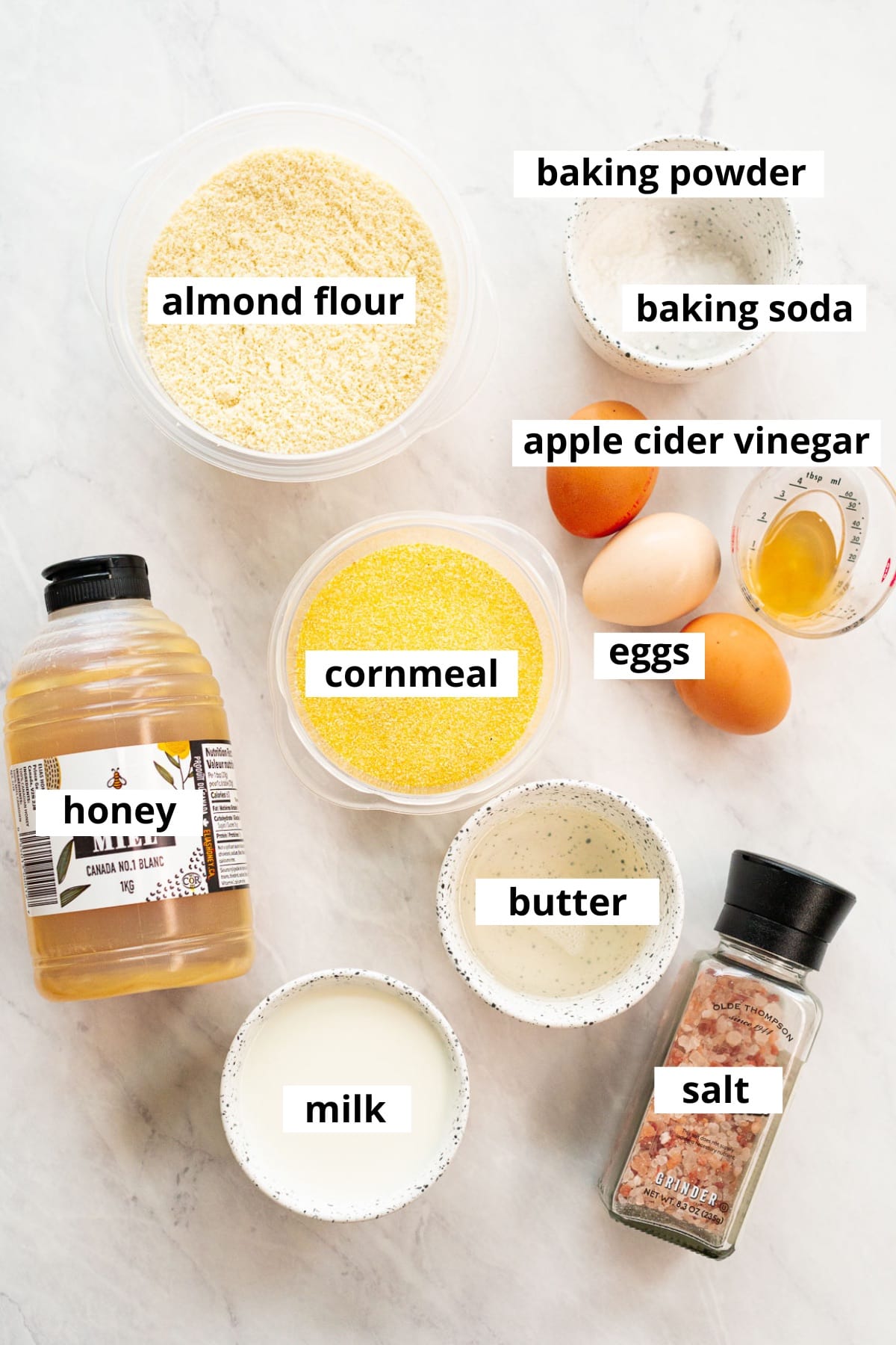 Almond flour, cornmeal, eggs, apple cider vinegar, baking powder, baking soda, honey, butter, milk, salt.