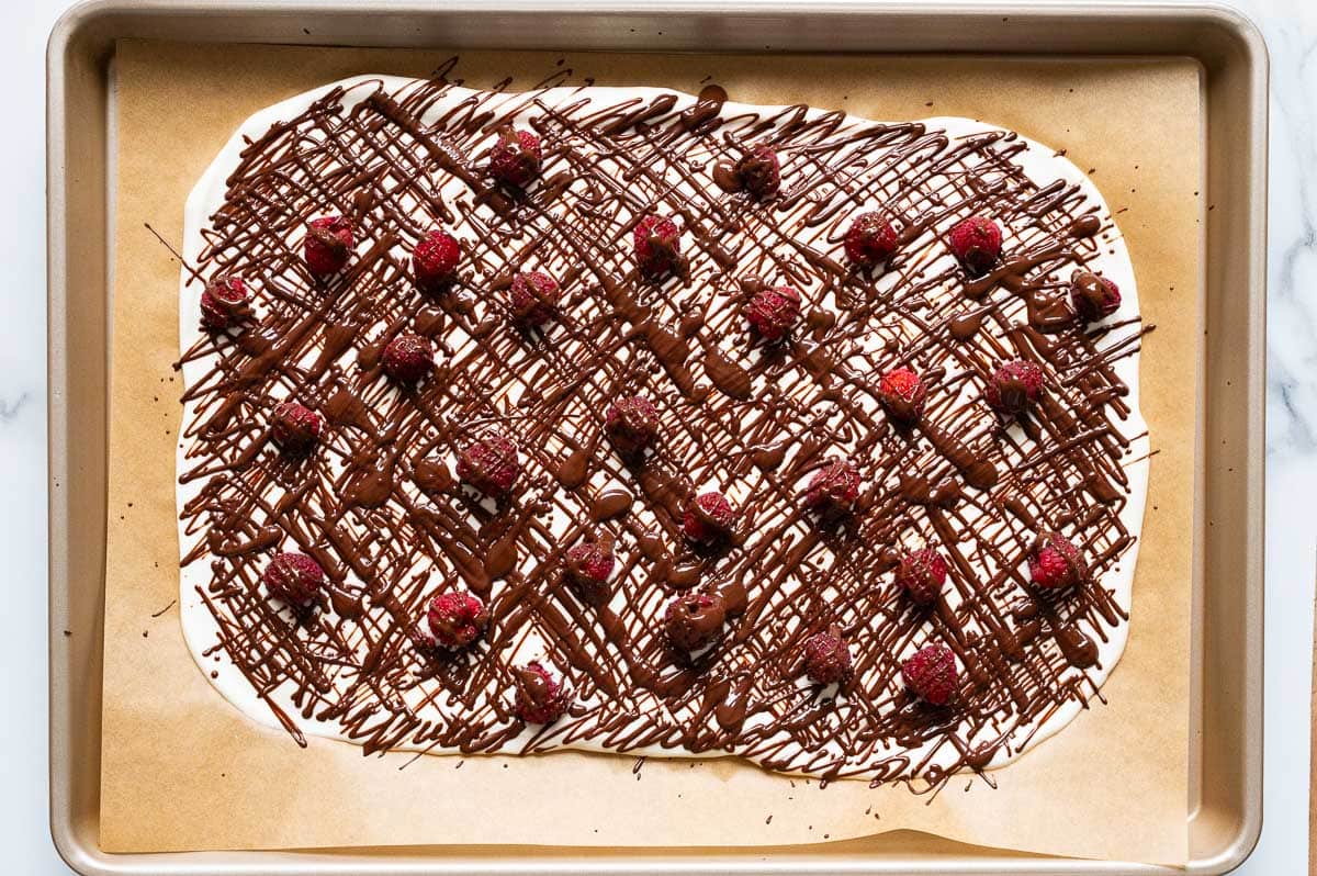 Finished cottage cheese bark on parchment paper lined baking tray.